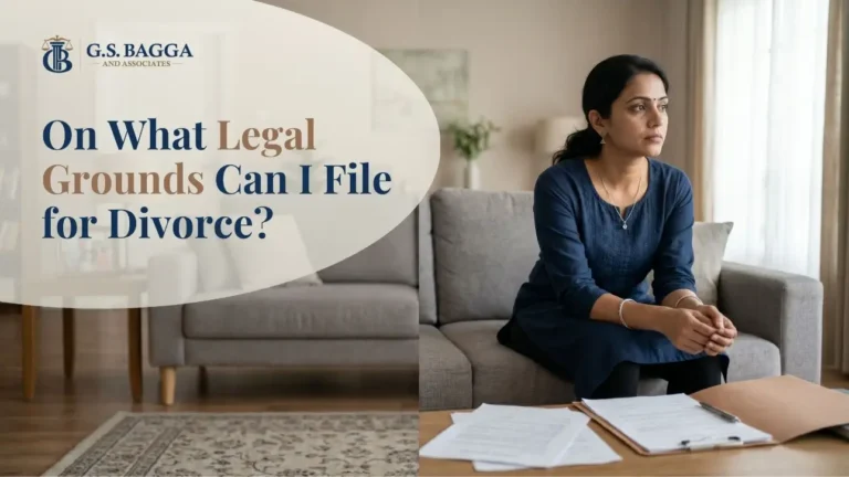 Indian woman sitting on a sofa looking thoughtful with divorce papers on a coffee table, contemplating legal grounds for divorce.